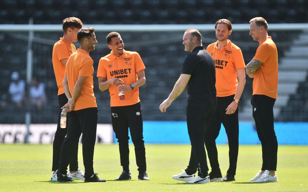 Уэйн Руни и игроки Дерби, Getty Images