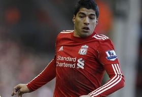 А уж когда он в форме Ливерпуля..., фото Reuters