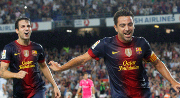 Хави празднует гол в ворота Гранады, фото football-espana.net