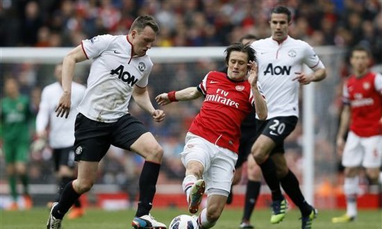 Росицки в окружении Джонса и РВП, AP