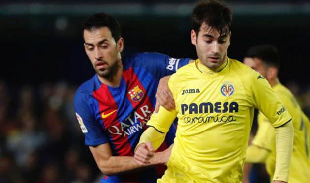 Серхио Бускетс (слева), AFP