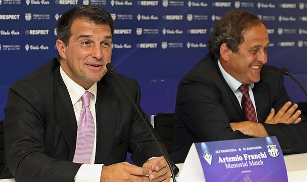 Жоан Лапорта (слева), Getty Images