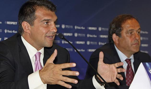 Жоан Лапорта (слева), Getty Images