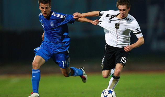 Никос Цуманис (слева), Getty Images