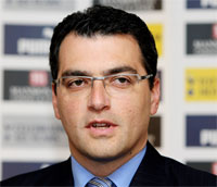 Дэмиен Комолли