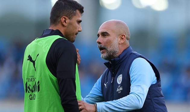 Rodry and Josep Guardiola, Getty Images
