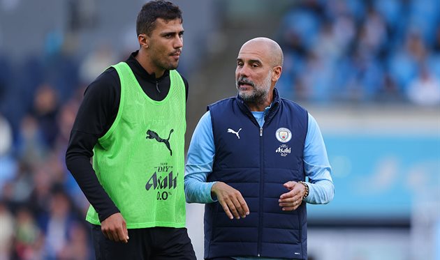Rodri and Pep Guardiola, Getty Images