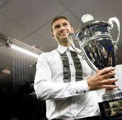Евгений Левченко с трофеем. Фото AFP 